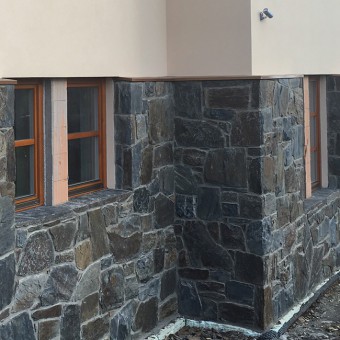 Detail of stone facade and window sils - Massive Rock